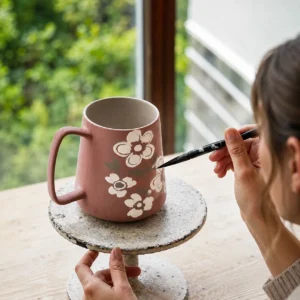 Artistic floral ceramic coffee cup with large 700ml capacity