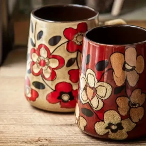 Large ceramic tea mug with colorful floral pattern and handle