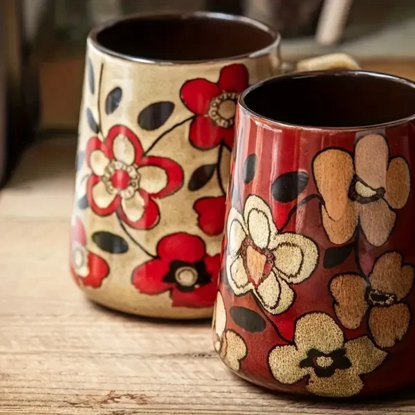 Large ceramic tea mug with colorful floral pattern and handle
